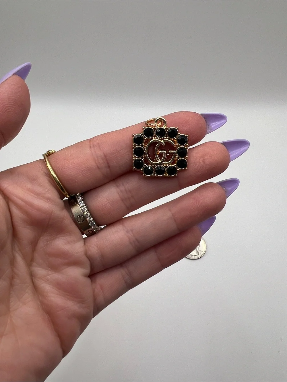 1430. Gold and Black Crystal Logo Charm Pendant